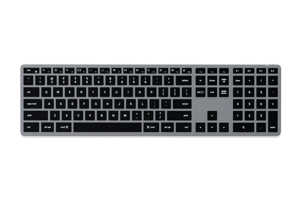A full-size wireless keyboard with a numeric keypad, featuring black keys on a silver base, is displayed from a top-down view.